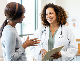 A woman talks to her doctor.