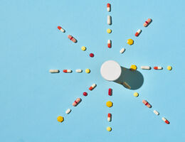 Medications arranged in the shape of the sun with rays. 