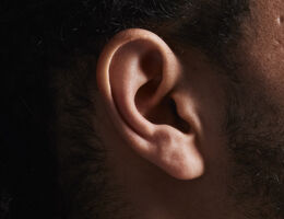 Close-up of a man's ear.